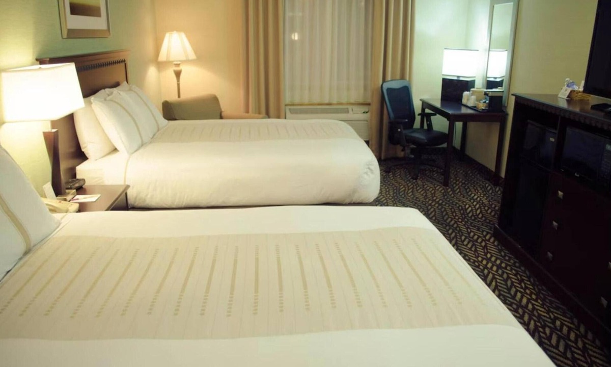 Devils Lake Hotel | 2 Rooms near Lake Region Heritage Center | Free Parking, Bfast, & Pool Access!