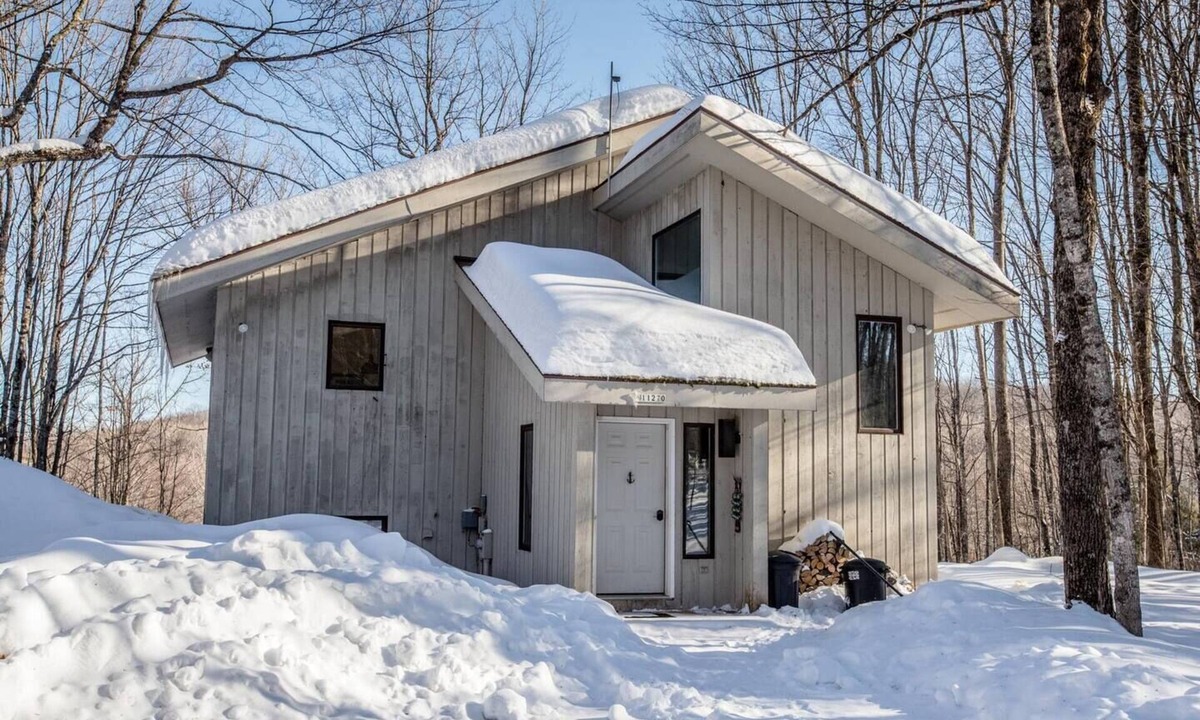 Bessemer Ski Chalet | A Spacious Vacation Home in a Wooded Setting With A Brick Fireplace