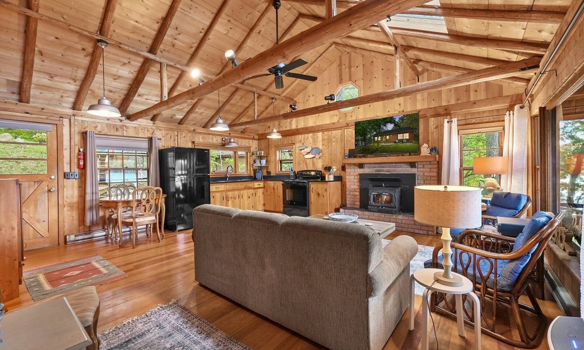 Le Roy Cabin | Cozy log cabin on Lake, fireplace, bonfire, kayaks, dock, orv trails, and grill,