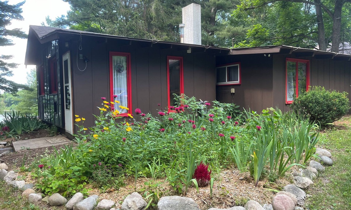 Lake Ann House | Cozy waterfront sunset cottage on Herendeene Lake in Lake Ann, Dock, Dog ok