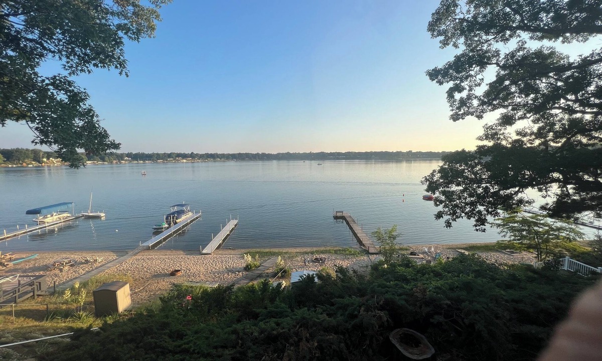 Wolf Lake House | Eagles Nest - Lake front escape with water and sunset views plus a sandy beach
