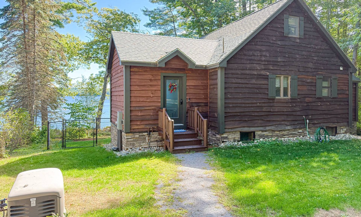 Rome House | Inviting Lakeside Home with direct dock access, patio seating, and gas fireplace