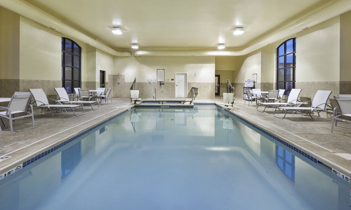 Okemos Condo | King Suite. Free Breakfast. Pool. Near Michigan State University.