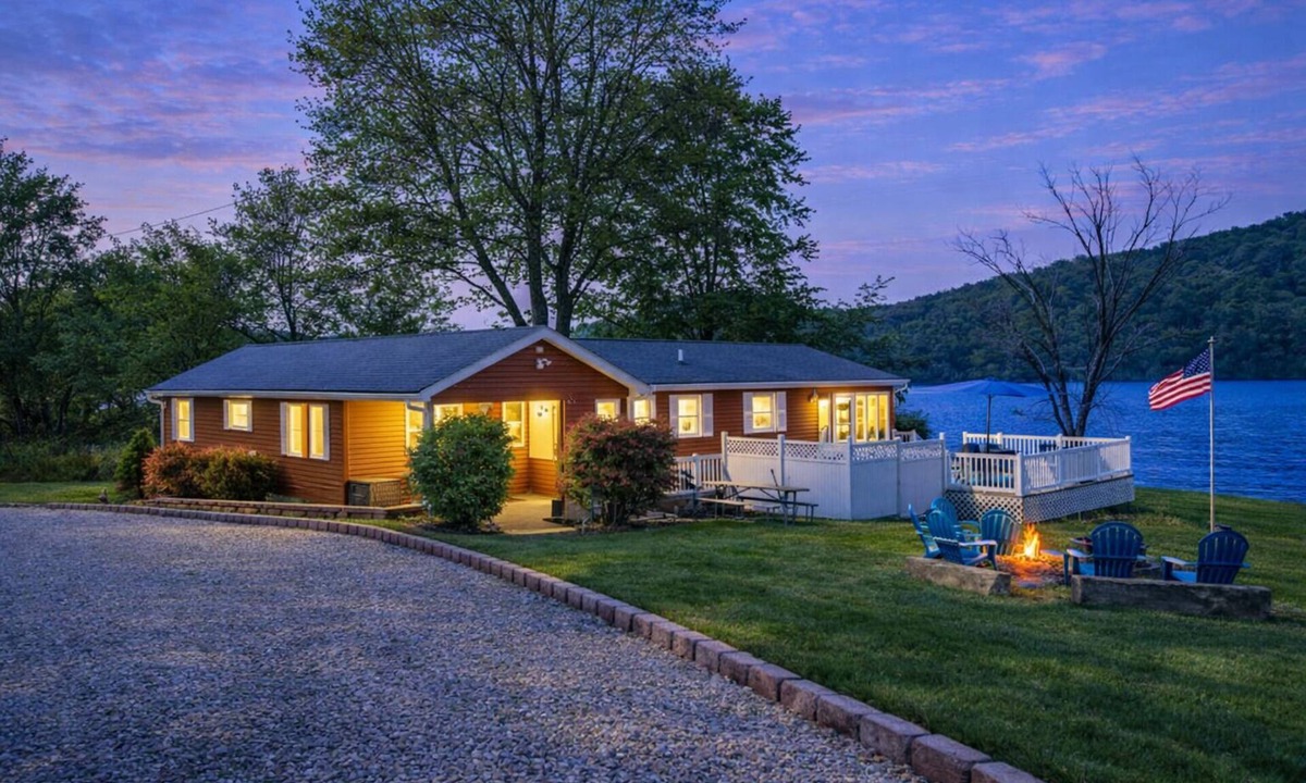 Logan Cottage | Lake Front Oasis: 3 BR 2 Bath w/dock, fire pit, sun room, hot tub on Lake Logan