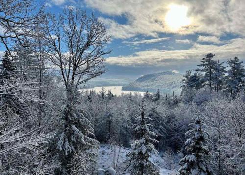 Bryant Pond Ski Chalet | Mountain getaway overlooking Lake Christopher