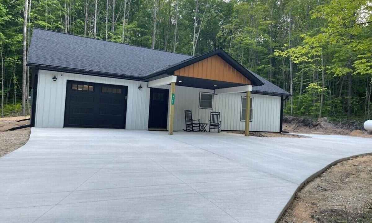 Manton House | Newly built barndominium in the forest.