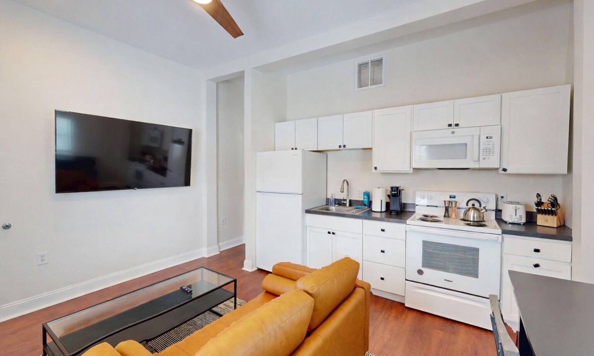 Marion Apartment | Newly renovated 1-bedroom apartment designed for comfort and convenience. Enjoy a king bed, 65” Smart TVs in the living room and bedroom, a fully stocked kitchen, workspace, and in-unit washer/dryer. Perfect for visiting Indiana Wesleyan University,