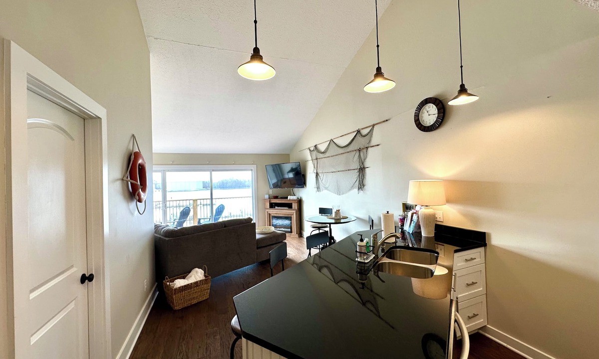 Port Clinton Condo | Relaxing 2-bed, 2 bath. River view with dock. Walk to Jet express!