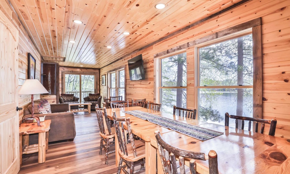 St Germain House | Remodeled lakeside resort cabin with fireplace, sandy beach, dock, firepit!