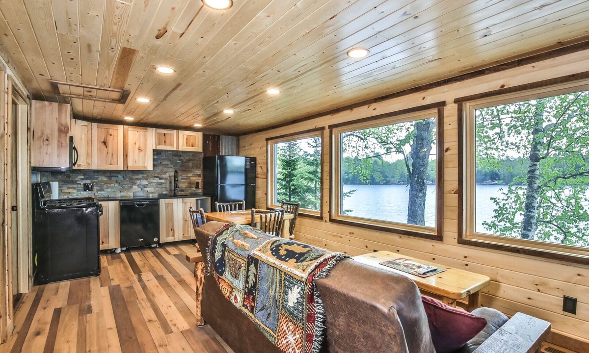 St Germain House | Remodeled lakeside resort cabin with fireplace, sandy beach, dock, firepit!