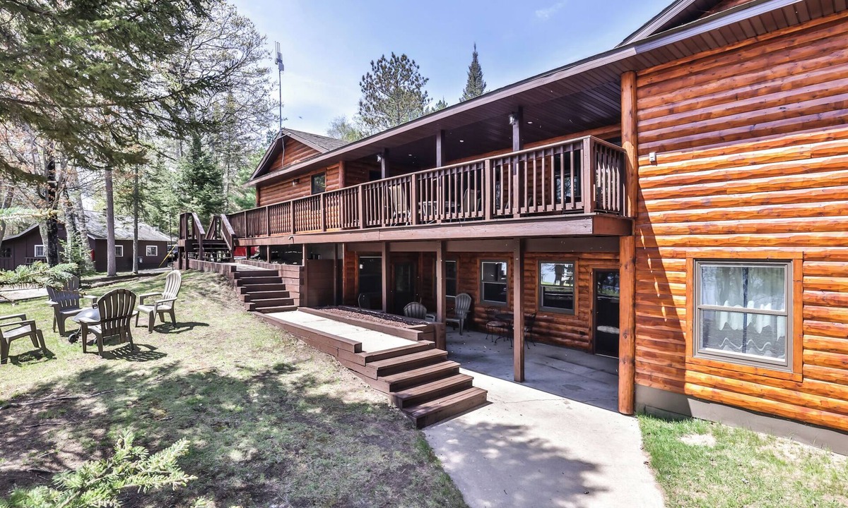 St Germain House | Remodeled lakeside resort lodge with fireplace, sandy beach, dock, firepit!