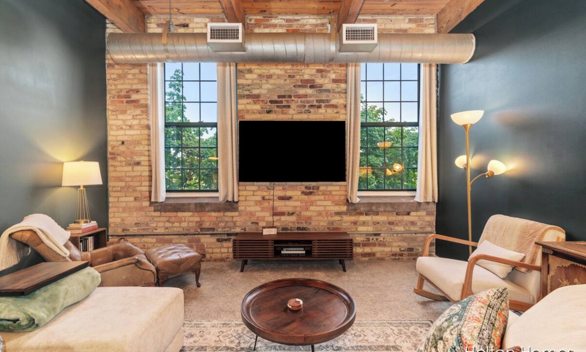Grand Rapids Condo | Riverfront Condo for Professionals with Workspace & Prime Medical Mile Access.