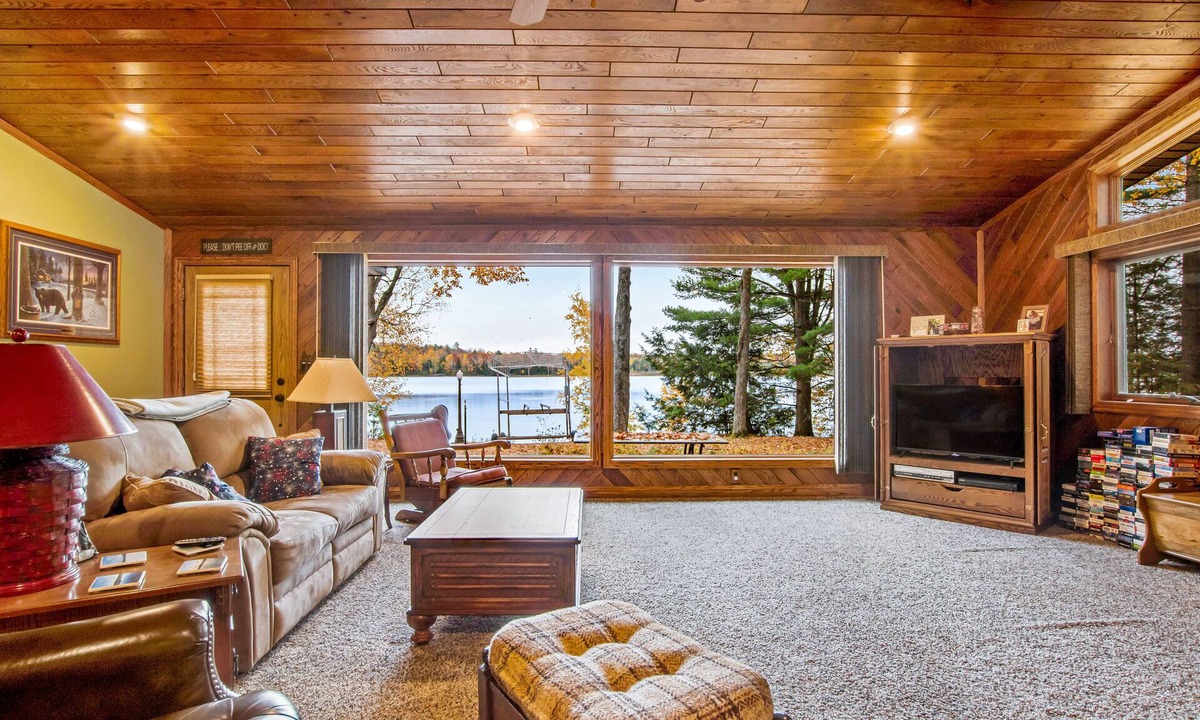 Lac du Flambeau House | Secluded lakefront home with kayaks, canoe, swim platform, firepit, & W/D