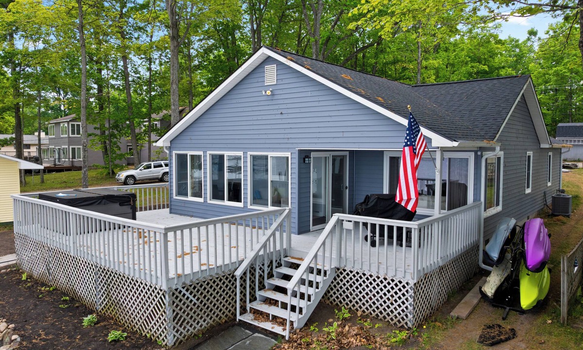 Cheboygan House | Serenity All Year Long : Lakefront 3BR, 3BA retreat with hot tub, dock, kayaks & fire pit.