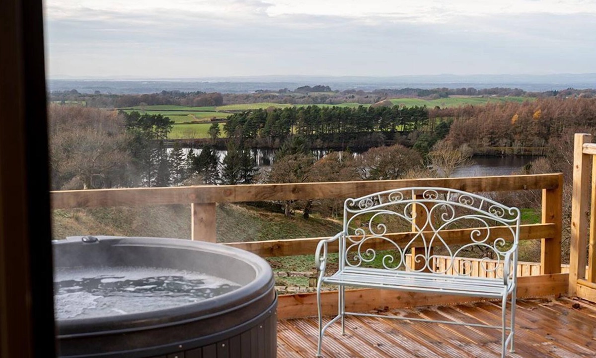 Castle Carrock Cottage | This luxury lodge has its own decking with hot tub