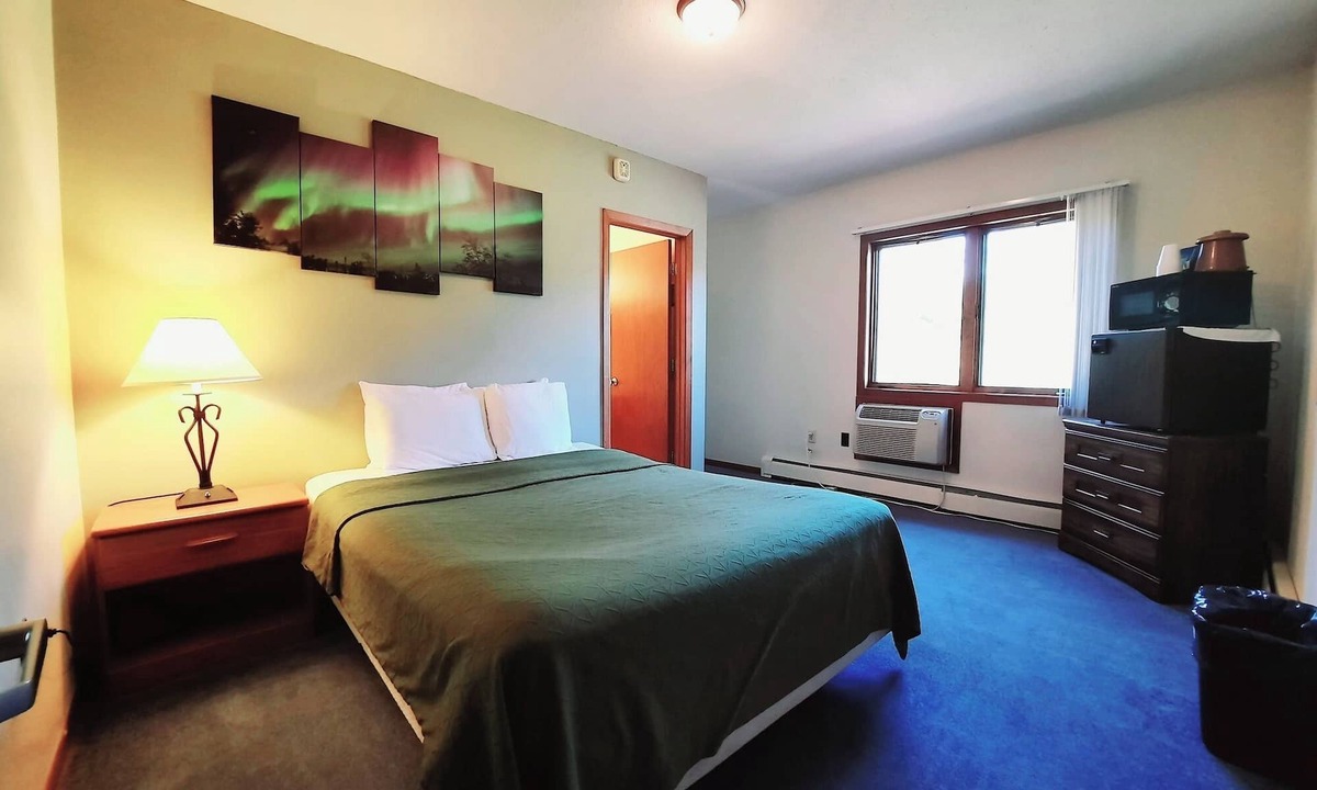 Ironwood Cabin | Unique Northern Lights Themed Guestroom inside the Lodge at North Ironwood Acres for up to Four people. 2 Queens, 2 Bathrooms. Dog Friendly resort!