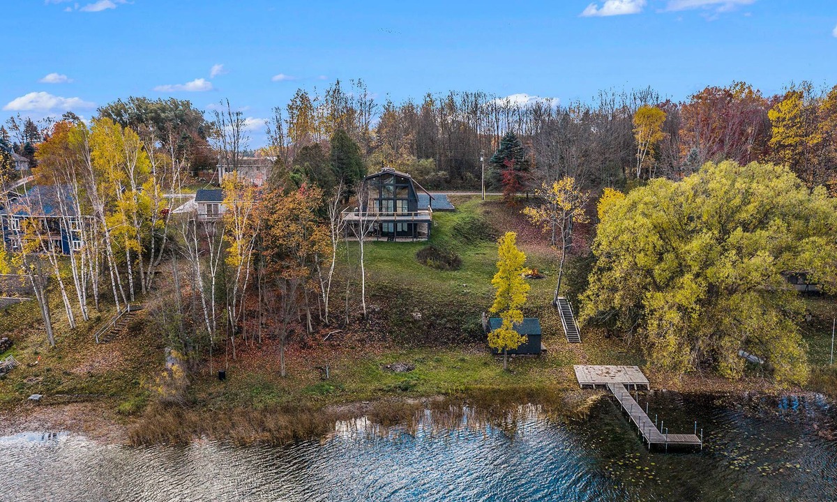 Scottville House | Waterfront Nordic Lodge on All Sports Lake, come with the whole family.