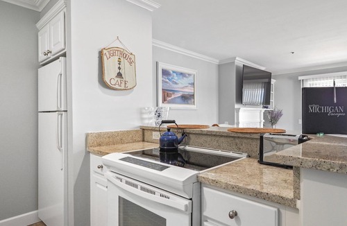 Boyne City Condo | 315 Water Street | Lake Charlevoix Condo | Private Beach Access | Fireplace