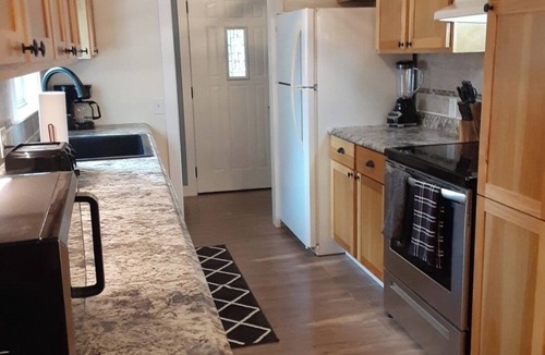 Tawas City House | 4-bedroom home in Tawas City with indoor pool and game room across from L Huron