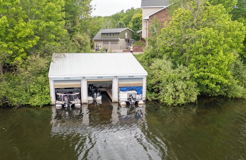 Ludington Condo | #4 Lakefront Hamlin Lake Retreat - Sleeps 10