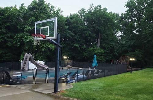 Heath House | 7 woodland Acres, secluded place with Pool, Pickleball, creek, and Hot Tub