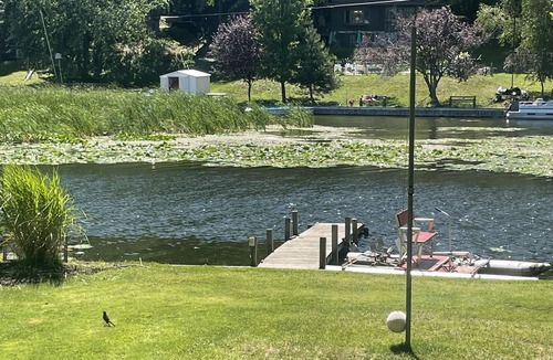 Ludington Cottage | #8 cottage comes with boat docks and shares over 600’ of frontage on Hamlin lake