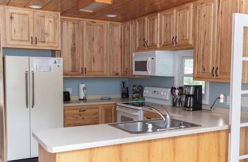 Bigfork Cabin | A-frame cabin with sandy swimming beach, 4 bedrooms, and amenities of home.
