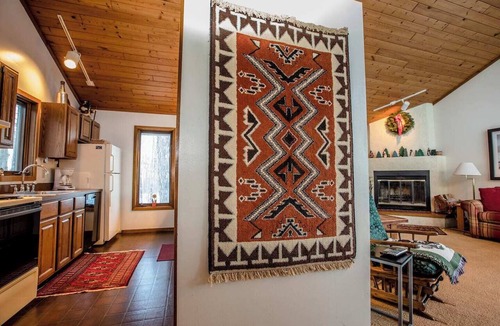 Bessemer Ski Chalet | A Spacious Vacation Home in a Wooded Setting With A Brick Fireplace
