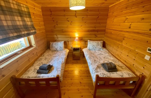 Gorebridge Cabin | A traditional Scandinavian style lodge, with stylish wooden interior decorated with a Scottish theme