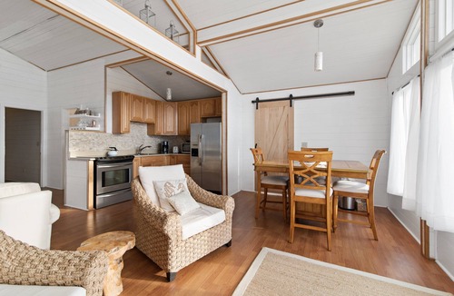 Carp Lake House | Bay Breeze (Carp Lake, MI) Summer Beachfront Bliss | Swim & Relax on Cecil Bay