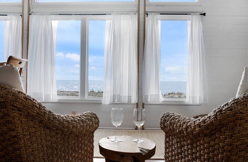 Carp Lake House | Bay Breeze (Carp Lake, MI) Summer Beachfront Bliss | Swim & Relax on Cecil Bay