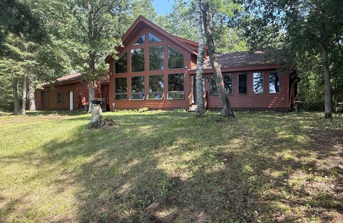 Bemidji Cabin | Beautiful home, giant windows, sand beach, dock w/boat lift. Premier lake!