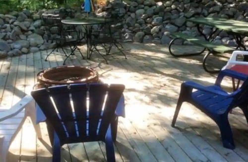 Ludington Cabin | Beautiful log cabin just minutes from the beach!
