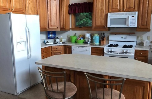 Onaway House | Black Lake sunset waterfront home 78' private sandy beach on prestine Black Lake