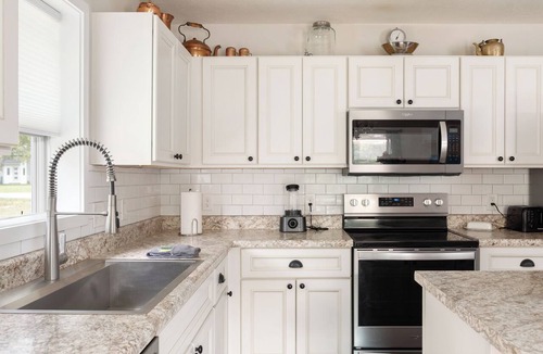 Interlochen House | Blissful Betsie - Private Hot Tub and Pet Friendly Fenced Yard in Interlochen