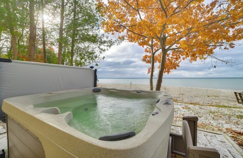 Alpena Cottage | Breathtaking Sunsets: Lake Huron Beachfront Escape