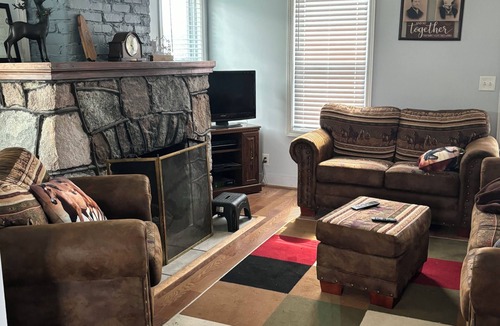 Ellsworth House | Charming 2-bedroom house on acreage in Ellsworth with stone fireplace and WiFi