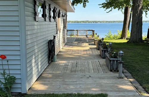Lake City Cottage | Charming Cottage on Sandy Beach with Beautiful Lake Views from Large Deck