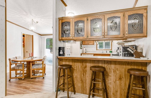 Boulder Junction House | Charming home with gas grill, full kitchen, deck, patio, TV, and washer/dryer