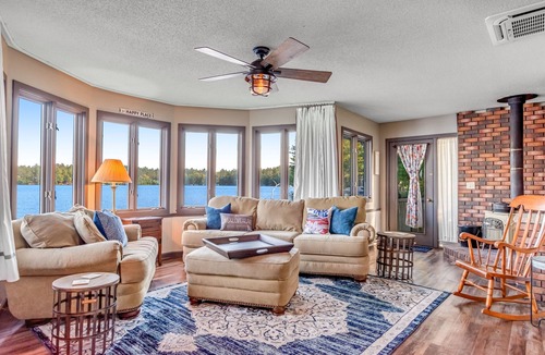 Three Lakes Cabin | Charming lakefront cabin with fireplace, on-site hot tub, firepit & games