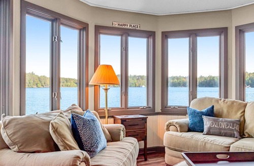 Three Lakes Cabin | Charming lakefront cabin with fireplace, on-site hot tub, firepit & games