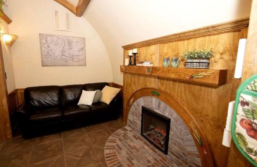 Springvale House | Charming Luxury Hobbit House with Private Hot Tub in Tranquil Woodlands on Littlefield Pond in Springvale, Maine