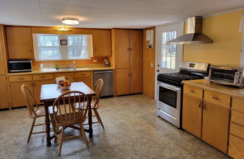 Sebascodegan Island House | Classic Maine House, wrap around deck, water activity a walk away.