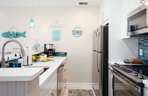 Traverse City Condo | Coastal Serenity 108 Beachfront Condo Near Downtown