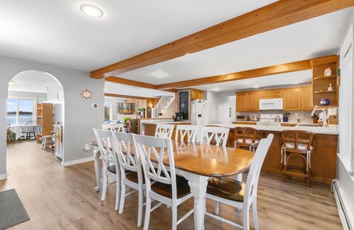 Winthrop House | Cobbossee Hideaway, lakefront property with dock for swimming, fishing, and sunrises