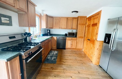 Glen Arbor House | Cottage in Glen Arbor with Crystal River frontage, canoe, FP, A/C, Dogs ok