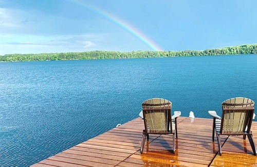 Spooner Cabin | Cozy 4BR Lake front Cabin on Big McKenzie w/Boathouse Bar, 2 Docks & Fire Pit