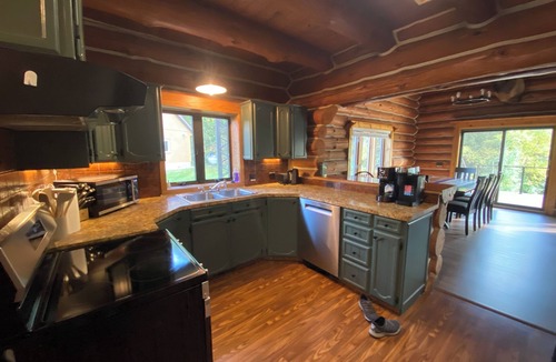 Pentwater Cabin | Cozy cabin on the Pentwater River with hot tub, central air and ample parking.