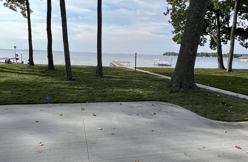 Houghton Lake House | Cozy Cottage, fresh laid sod, new concrete patio and sidewalk, sandy beach!
