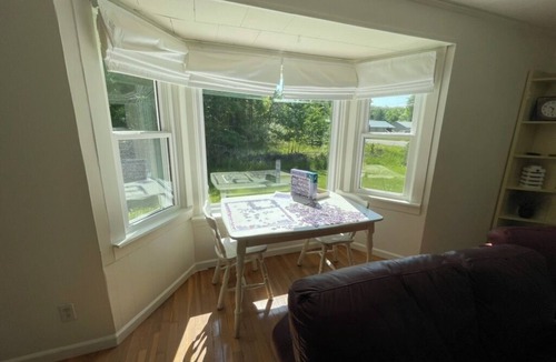 Higgins Lake House | Cozy cottage with Higgins Lake peek-a-boo views